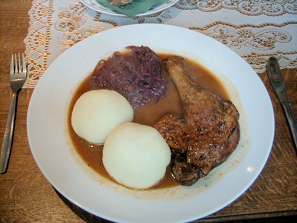 A picture of a typical meal in Thuringia - dumplings with red cabbage and duck.